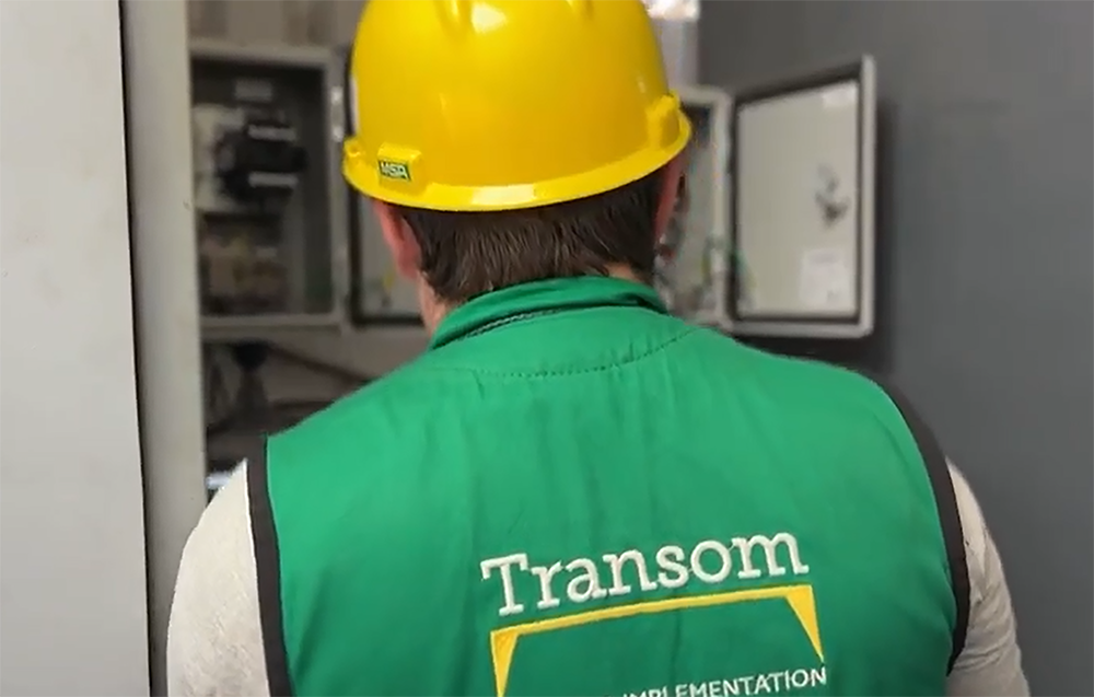 Engineer operating SCADA control panel at industrial plant in Winnipeg